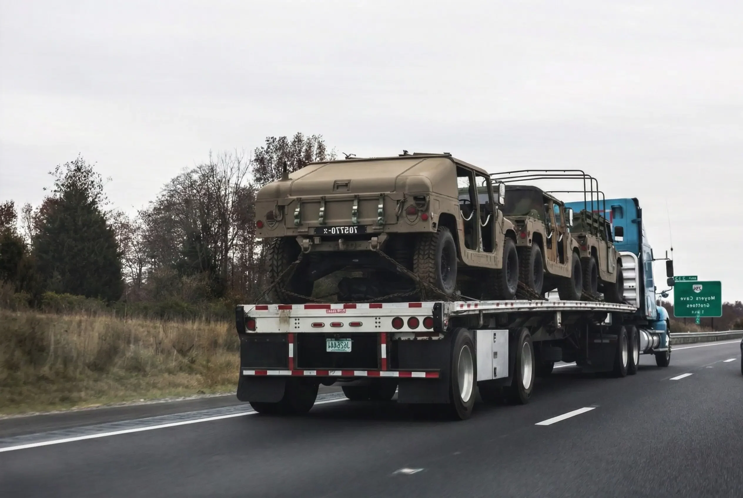 military cars on the flatbed trailer