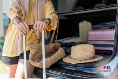 Student packing luggage into a car before driving to college
