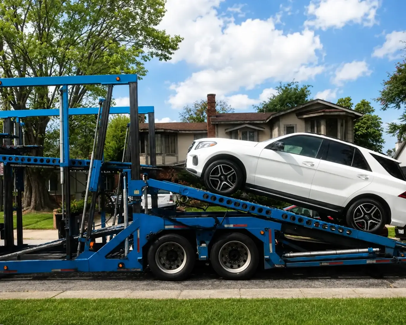 door-to-door car transport truck drops off a car at the door